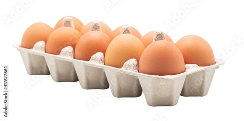 Eggs in egg carton side view isolated