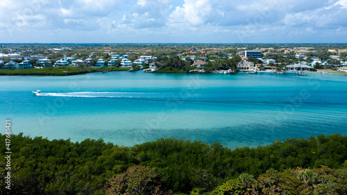 Beautiful beaches of Jupiter Island and its emerald green and aqua blue waters coastal Florida with the horizon in the background