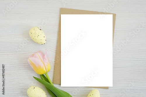 Canvas Print Easter vertical greeting card, invitation, thank you card mockup for design presentation, brown envelope, tulips and decorative eggs