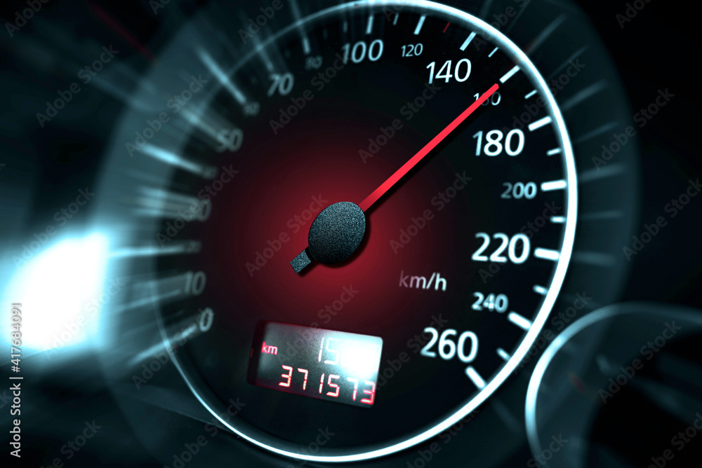 The speedometer of a modern car shows a high driving speed. Added motion blur.