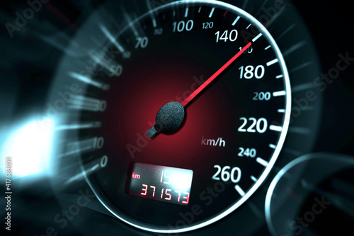 The speedometer of a modern car shows a high driving speed. Added motion blur. photo