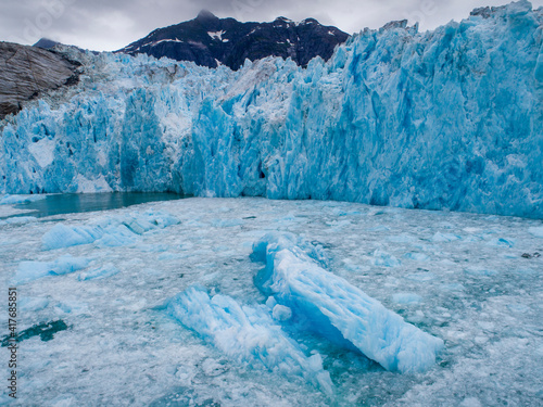 USA, Alaska, Aerial view of shattered icebergs floating near calving face of ...