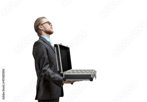 Картината върху платно businessman holds suitcase with cash dollars