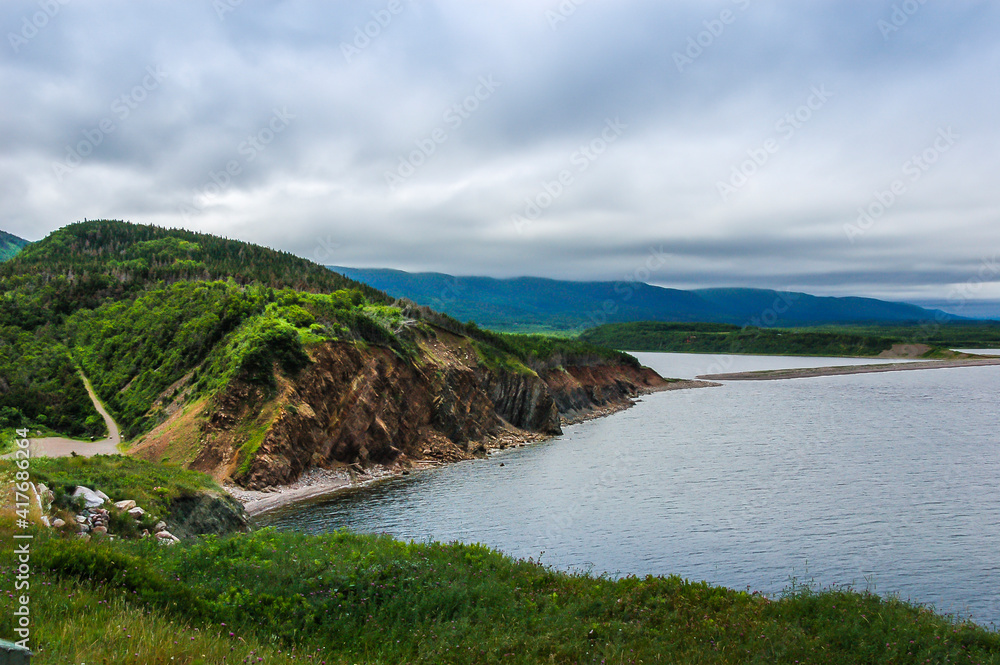 A rock cliff on the shore in Cape Breton Island Nova Scotia Canada.