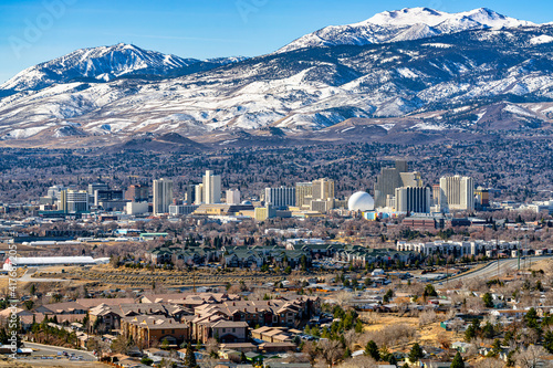 City of Reno Nevada cityscape showing the downtown skyline with Hotels, Casinos and the surrounding residential area with snow capped mountains background. photo