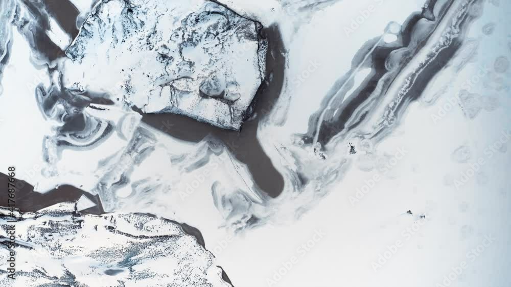 Beautiful blue ice glacier in Iceland covered with snow aerial view on a sunny winter day in Iceland Beautiful blue ice glacier in Iceland covered with snow aerial view on a sunny winter day in Iceland