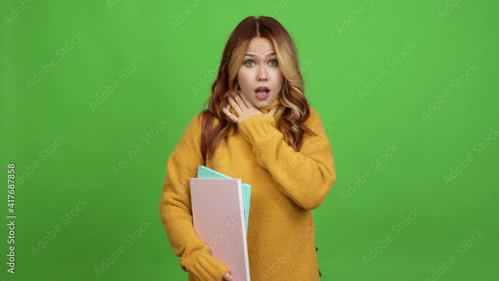 Teenager woman with backpack gaping because have just surprised with a gift over isolated background chroma key Teenager woman with backpack gaping because have just surprised with a gift over isolated background chroma key