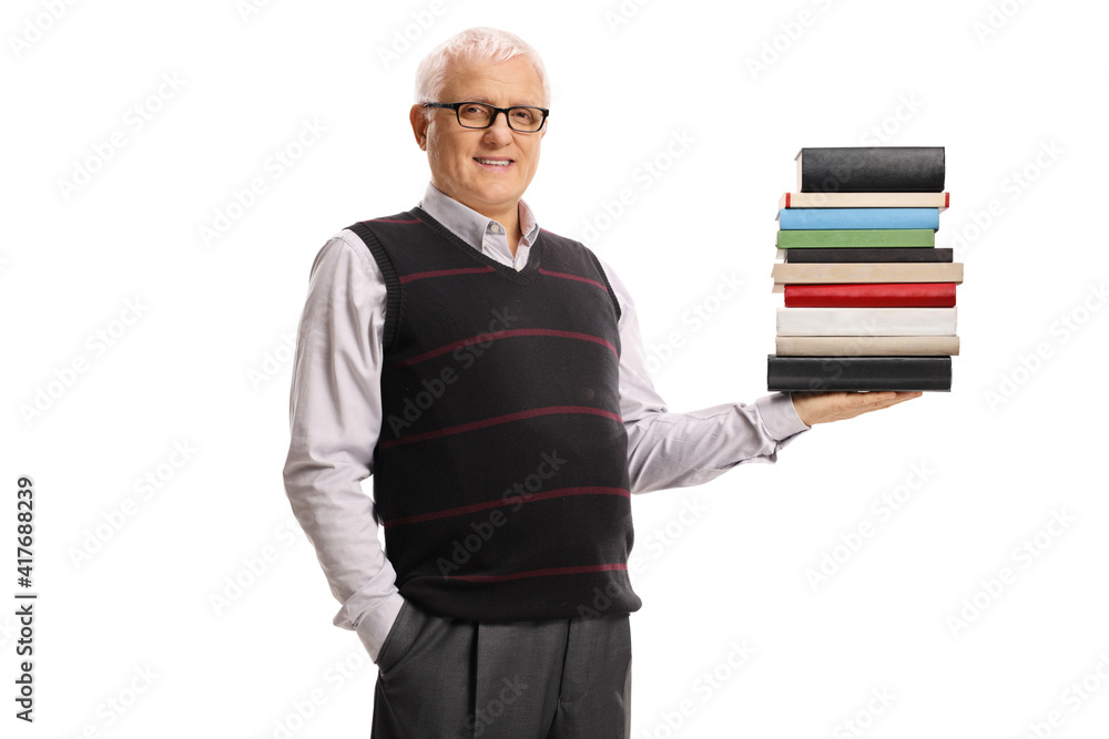 Mature man holding a pile of books and smiling Mature man holding a pile of books and smiling
