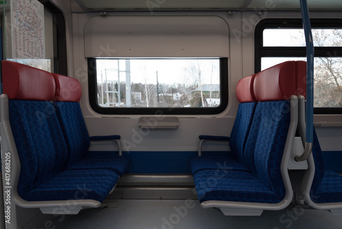 Empty train carriage. Modern new railroad car. The concept of the absence of tourists, quarantine © dewessa