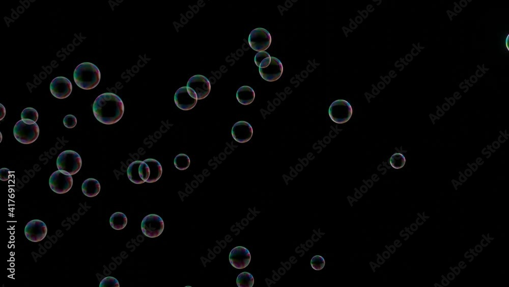 Animation 3d rendering of a soap bubble with rainbow reflection blown by the wind floats in the air. With black background for add to your vdo with screen layer blending mode. Animation 3d rendering of a soap bubble with rainbow reflection blown by the wind floats in the air. With black background for add to your vdo with screen layer blending mode.