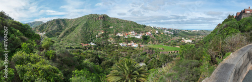 Panoramic view over green hill and valley of botanical garden, Jardin Botanico Canario Viera y Clavijo, Tafira, Gran Canaria, Canary Islands, Spain photo