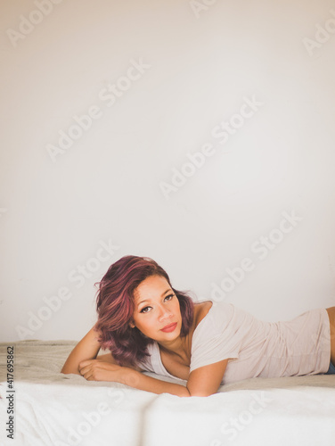 woman relaxing on bed