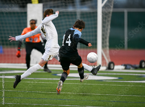 Athletic boy making amazing plays during a soccer game