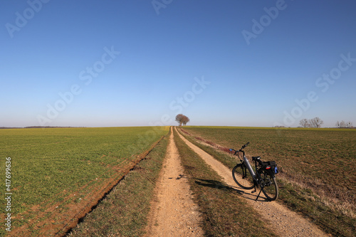 First spring bike rides among green fields