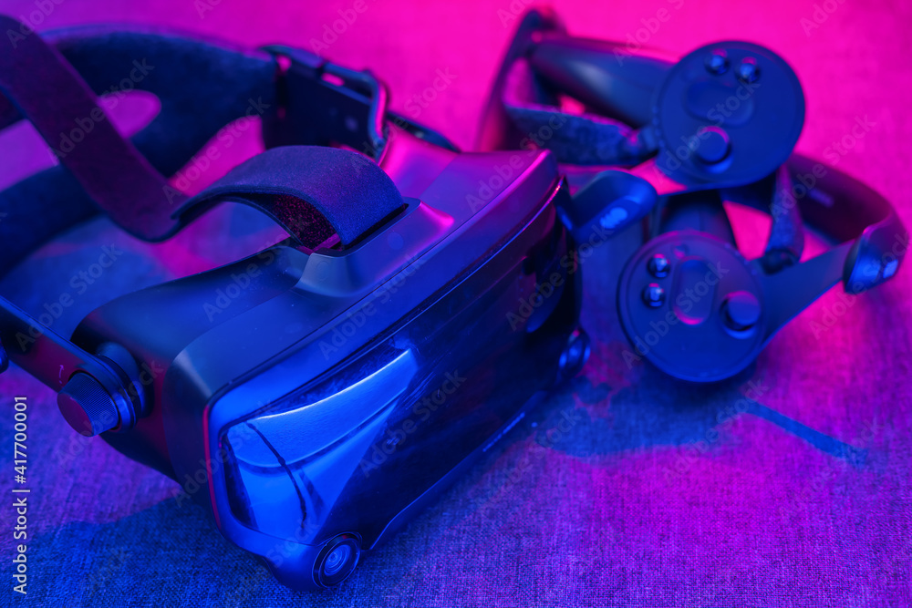 GRODNO, BELARUS - MARCH 2021: VR AR 360 virtual reality glasses headset  valve index on neon blue violet background. Device for watching movies for  travel and entertainment in 3d space. Stock Photo | Adobe Stock