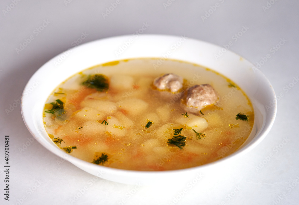 meatball soup poured into a plate meatball soup poured into a plate