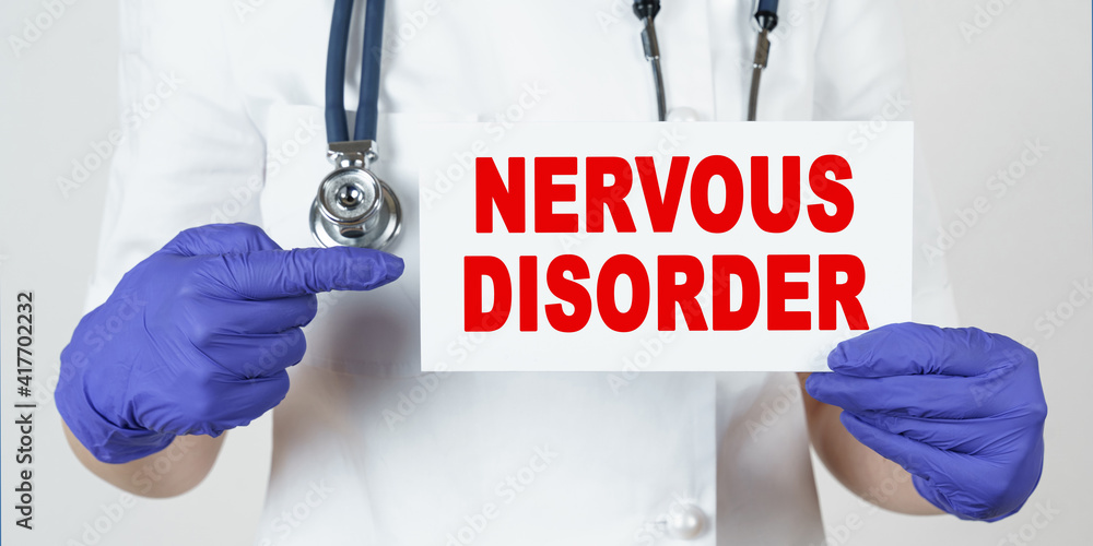 The doctor points his finger at a sign that says - NERVOUS DISORDER The doctor points his finger at a sign that says - NERVOUS DISORDER