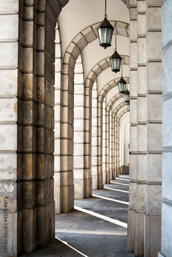The arches in the arcaded corridors and interiors in church filled with sunlight The arches in the arcaded corridors and interiors in church filled with sunlight