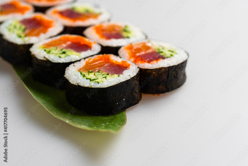 Overhead japanese sushi food. Maki ands rolls with tuna, salmon, shrimp, crab and avocado. Top view of assorted sushi, all you can eat menu. Overhead japanese sushi food. Maki ands rolls with tuna, salmon, shrimp, crab and avocado. Top view of assorted sushi, all you can eat menu.