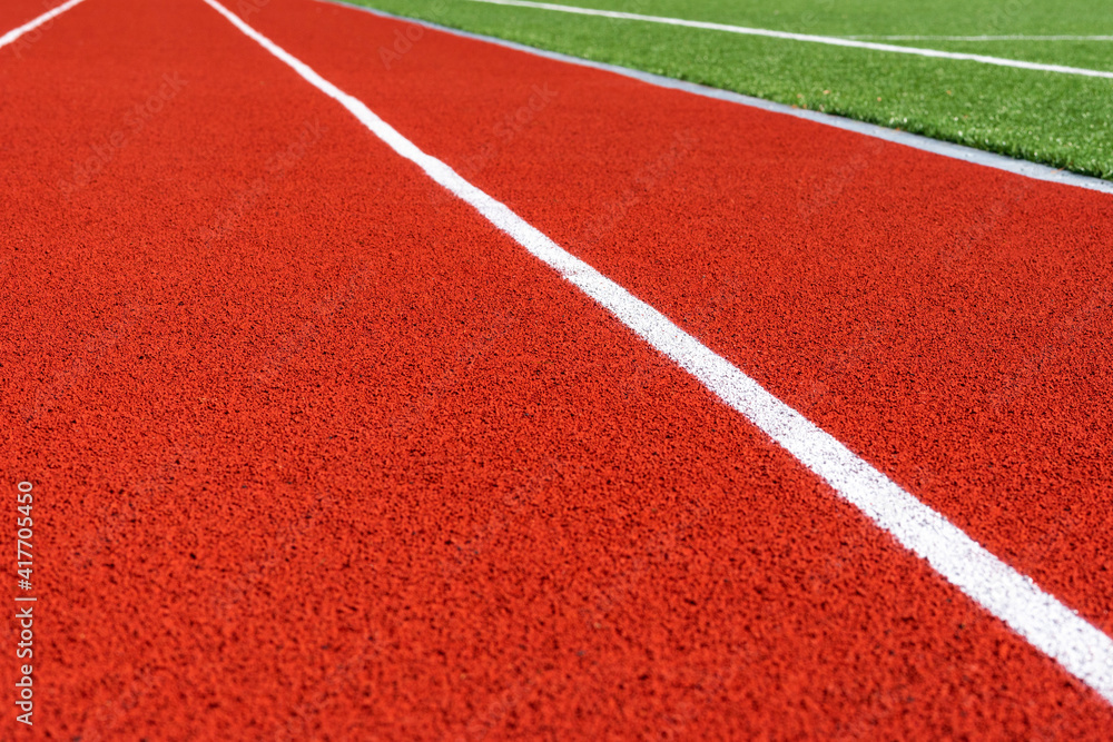 Red treadmills at the stadium.Running Track . Red treadmills at the stadium.Running Track .