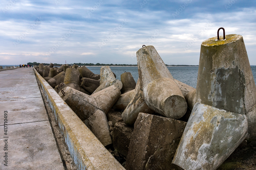Coastal concrete fortifications. Reinforced concrete structures along the sea pier.