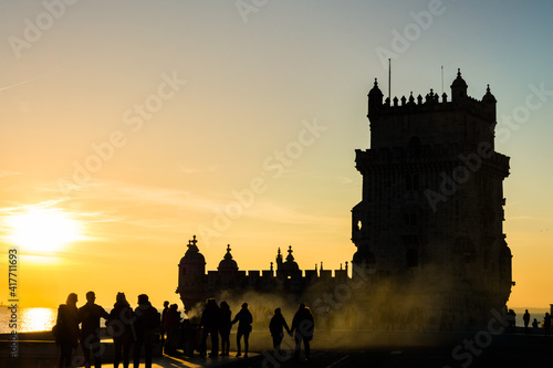 tourist place in Belem, Portugal, with smoke related with the temperature and people walking
