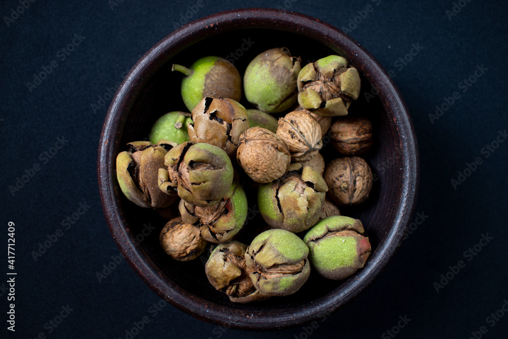 walnuts in shell in clay dish walnuts in shell in clay dish