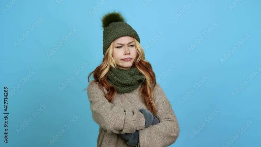 Teenager woman with winter hat having doubts and questioning an idea over isolated background Teenager woman with winter hat having doubts and questioning an idea over isolated background