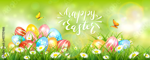 Green Easter Background with Colorful Eggs