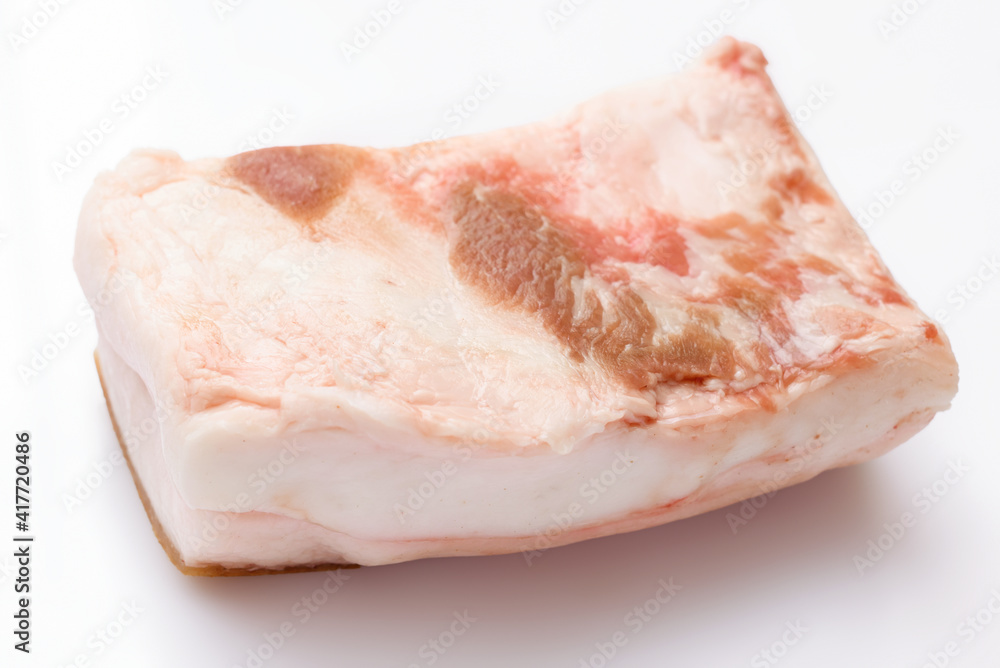 raw lard piece on white background, pork fat