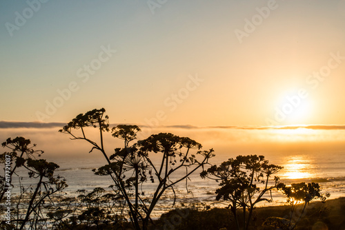 USA, California. Sunset over the Pacific Ocean, seen from Pacific Coast Highway on San Simeon North Shore.