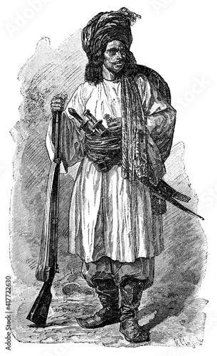 Afgan soldier in Russian Service. Culture and history of Asia. Vintage antique black and white illustration. 19th century.