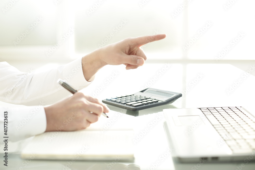 Hands of a man working in an light office Hands of a man working in an light office