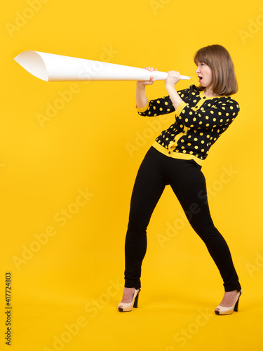 The woman shouts into a meg...