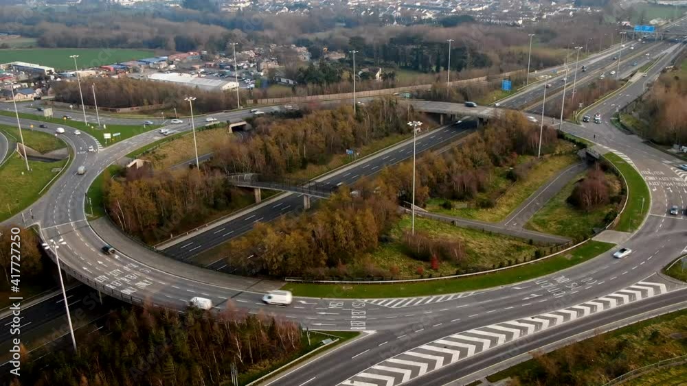 A timelapse of traffic moving around roundabout in rush hour. A timelapse of traffic moving around roundabout in rush hour.
