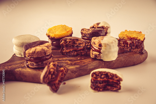 alfajores de chocolate: a traditional dessert from Latin America, Argentina and Uruguay. Vanilla cookies with dulce de leche, chocolat and coconut