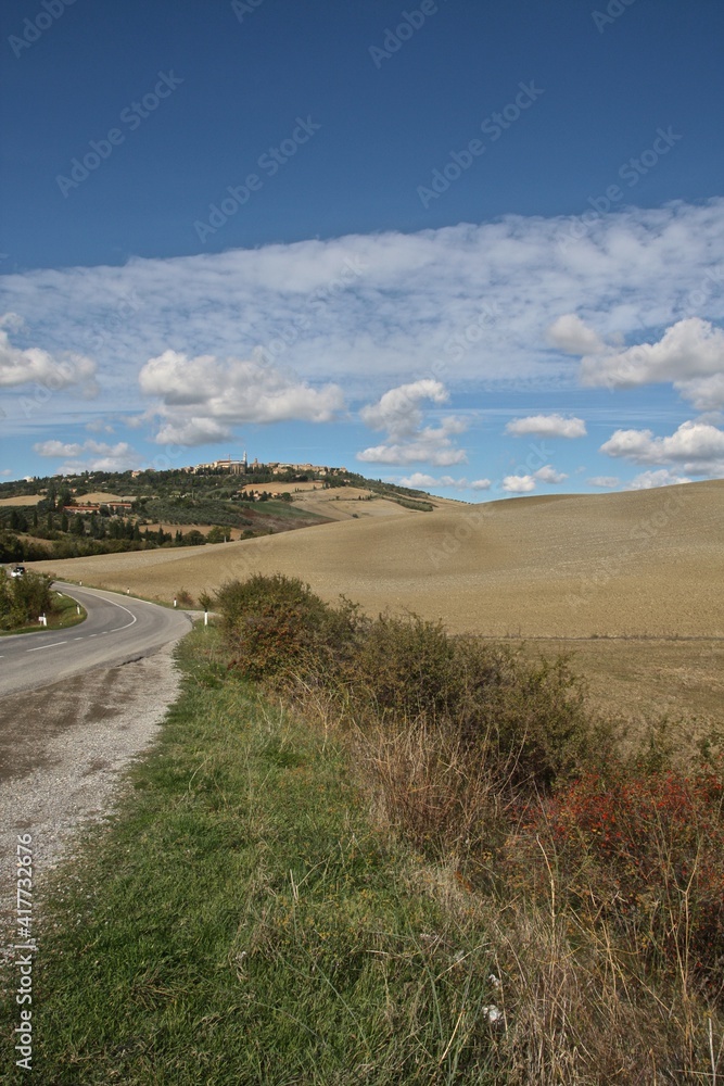 Tuscany, Italy. Rural road towards medieval town. Tuscany, Italy. Rural road towards medieval town.