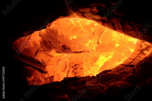 Anthracite coal is ignited by burning wood.