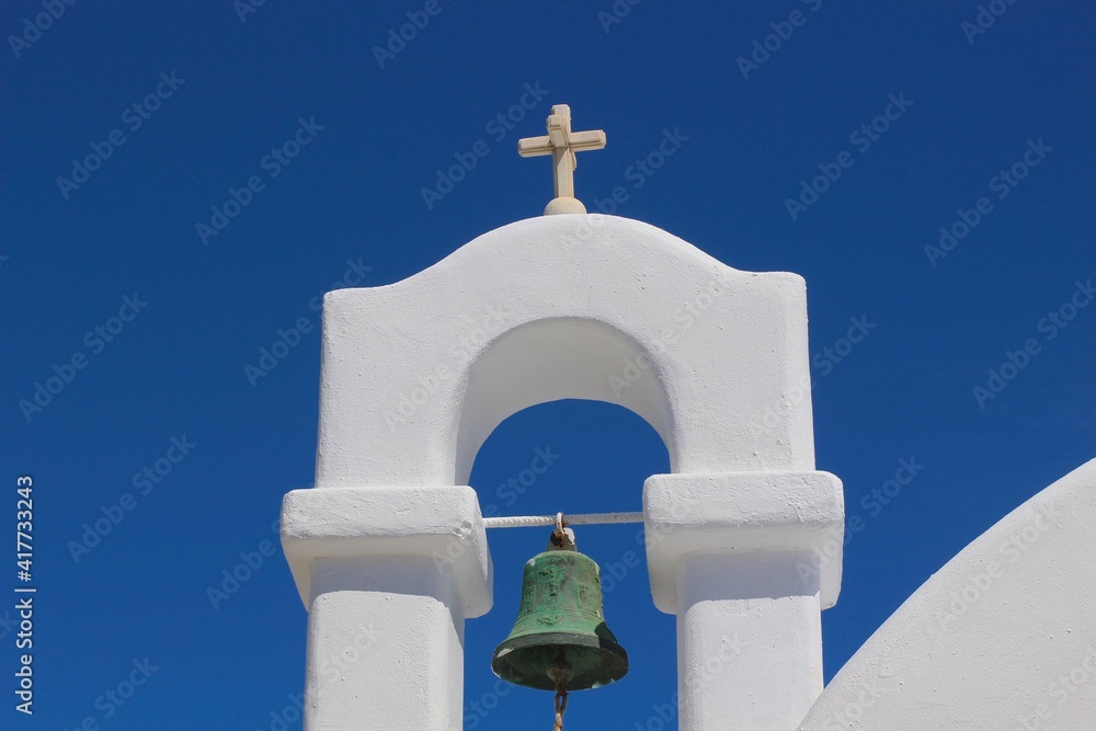 Mykonos, Greece. Orthodox bell tower with blue sky background. Mykonos, Greece. Orthodox bell tower with blue sky background.