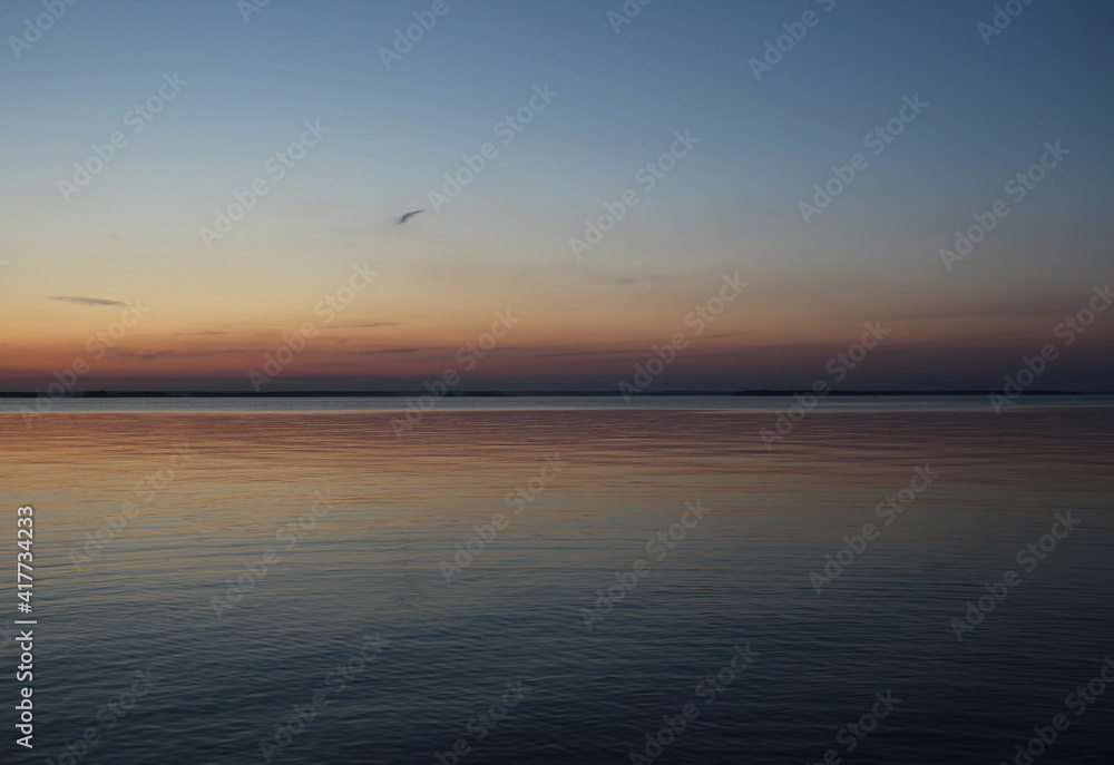 sunset at sunrise in the sea on the horizon with rays in the water sunset at sunrise in the sea on the horizon with rays in the water