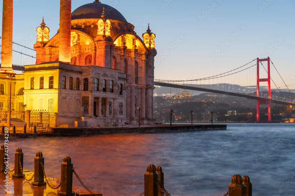 Morning in Ortakoy Square. Sunrise behind Ortakoy Mosque. Ortakoy is on Istanbul Bosporus side and populer touristic destination. 