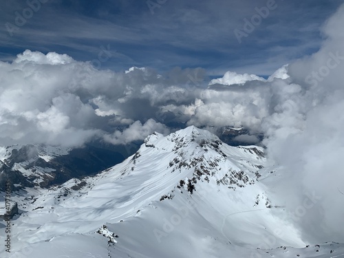 A panoramic view of snow capped Alps and glaciers seen from Schilthorn, Switzerland