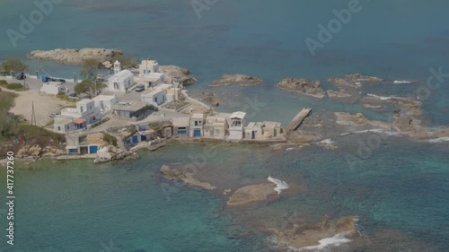 Slow Aerial Tilt Up of the Fishing Village of Mandrakia in the Island of Milos photo