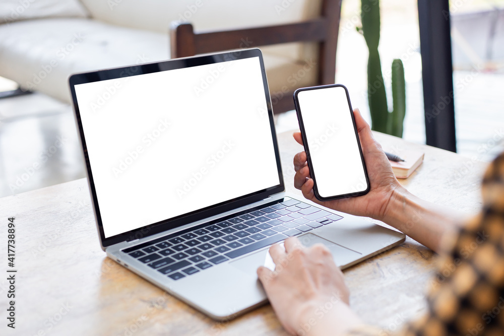 computer screen,cell phone blank mockup.hand woman work using laptop texting mobile.white background for advertising,contact business search information on desk in cafe.marketing,design computer screen,cell phone blank mockup.hand woman work using laptop texting mobile.white background for advertising,contact business search information on desk in cafe.marketing,design