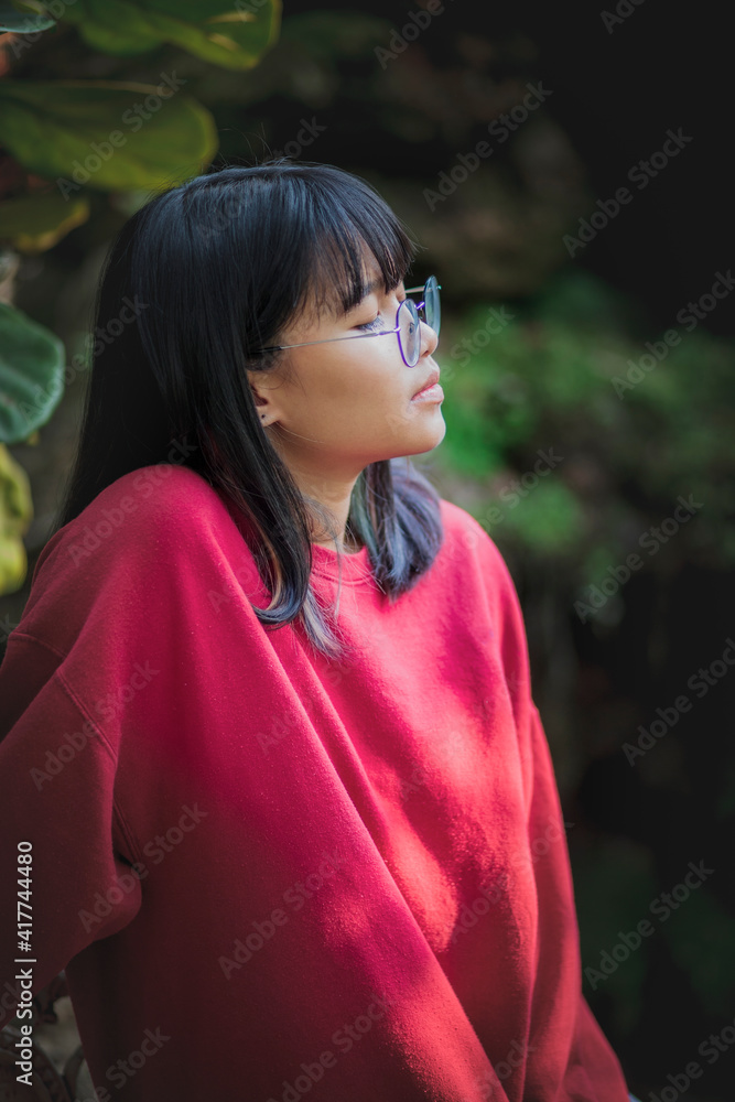 portrait of asian teenager wearing eyeglasses standing outdoor portrait of asian teenager wearing eyeglasses standing outdoor