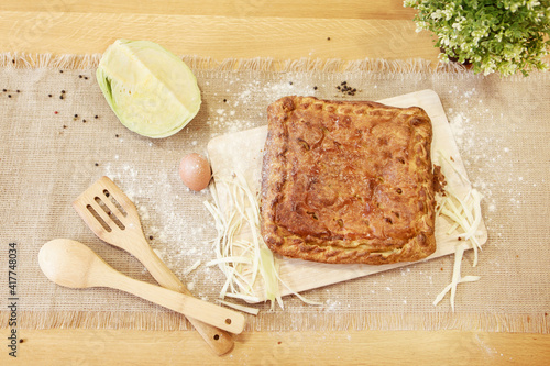 Pie on a chopping board. The food is ready to eat. Puff Pastry pastry