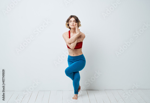 woman in blue leggings gymnastics sport fitness yoga asana