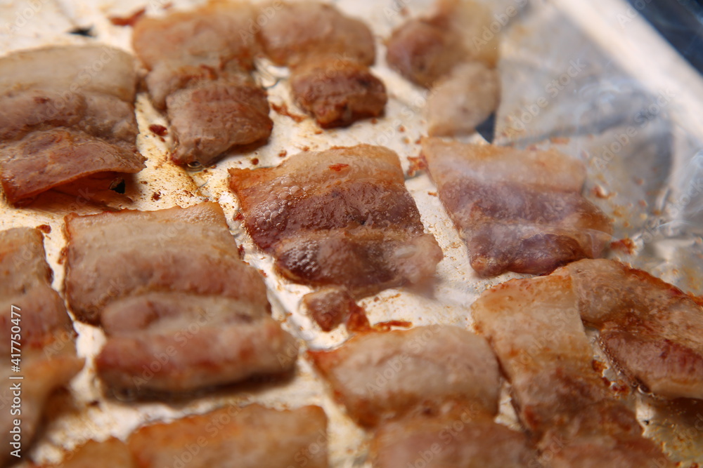 Frozen pork belly is getting cooked on foil. 호일위에 냉동삼겹살이 익어가는 모습 Frozen pork belly is getting cooked on foil. 호일위에 냉동삼겹살이 익어가는 모습