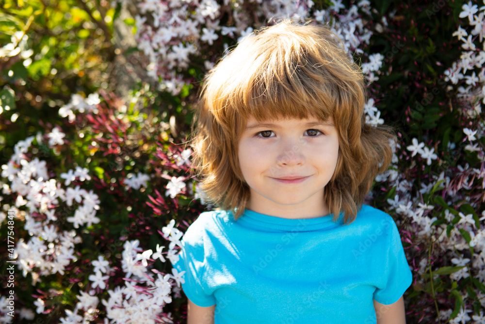 Happy smiling boy outdoor. Spring flower park. Childhood and kids adaptation. Happy smiling boy outdoor. Spring flower park. Childhood and kids adaptation.