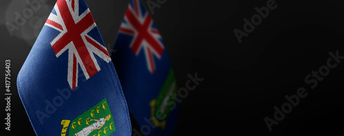 Small national flags of the British Virgin Islands on a dark background photo